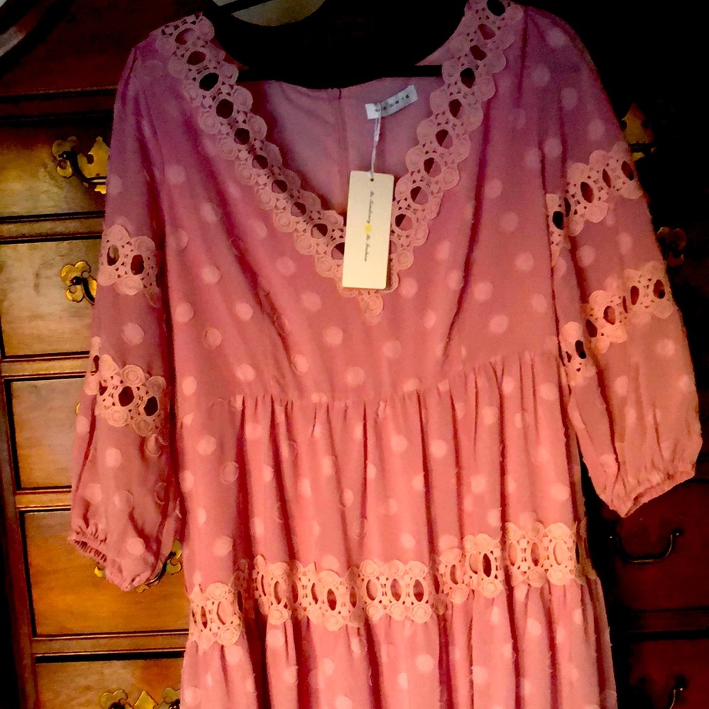 This is a beautiful lilac colored dress that is very well made. It is lined.